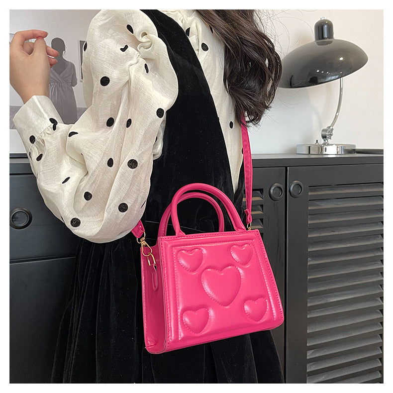 1pc Women’s Stylish Solid Color Handbag with Detachable Strap – Heart Pattern Design, Perfect for Valentine’s Day Gift, Available in Magenta, White, Black, Green, Yellow